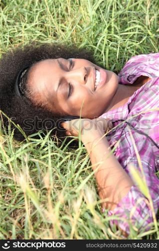 young woman lying on the grass