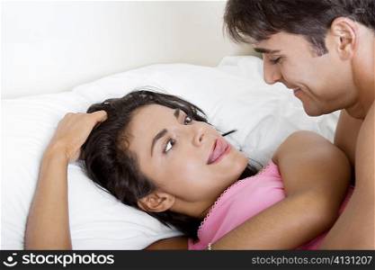Young woman making a face at a young man