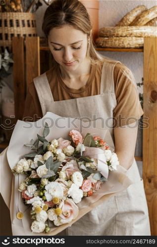 young woman making pretty floral arrangement 2