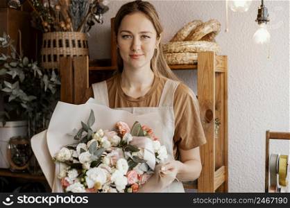 young woman making pretty floral arrangement 3