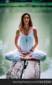 Young woman meditating with her eyes closed.