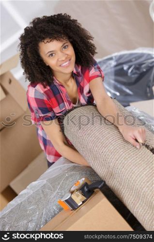 young woman moving in to new house