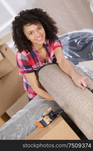 young woman moving in to new house