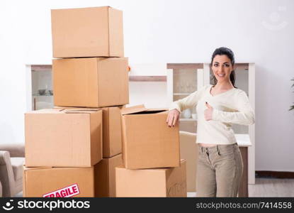 Young woman moving to new flat 