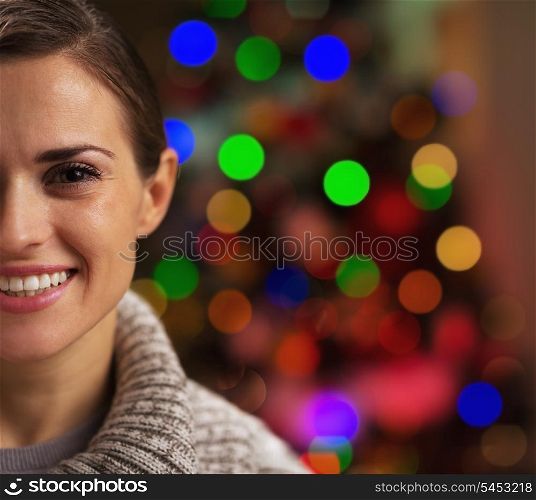Young woman near christmas tree