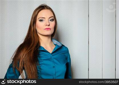 Young woman office worker stand indoors.. Career business work in office formal wear. Young women worker present stand with confidence.