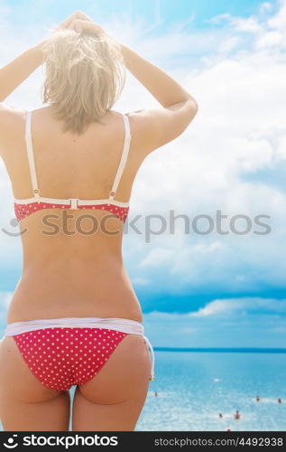 Young woman on a beach. Young woman on a summer beach in sunny day