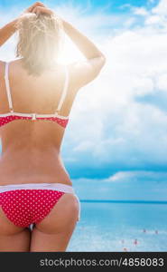 Young woman on a beach. Young woman on a summer beach in sunny day