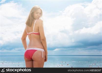 Young woman on a beach. Young woman on a summer beach in sunny day