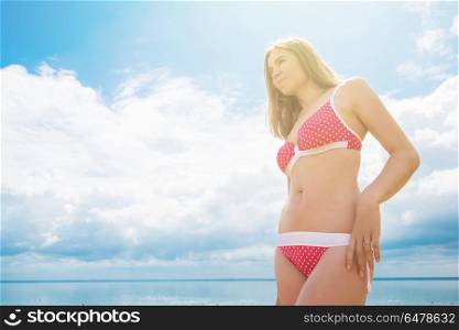 Young woman on a beach. Young woman on a summer beach in sunny day