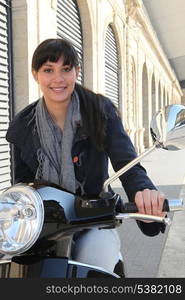 Young woman on a scooter