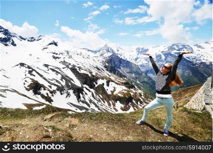 young woman on background of snowy mountains