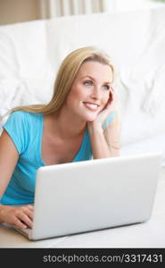 Young woman on her laptop computer