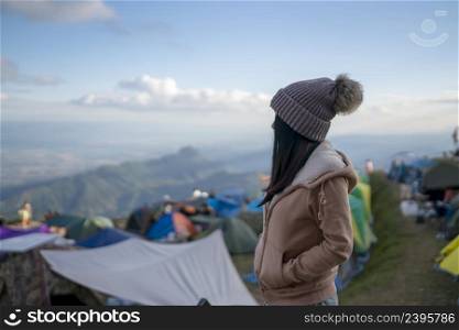 young woman on holiday freedom standing on the mountain Phu Thap Boek Phetchabun, Thailand.