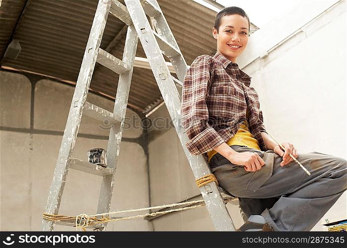 Young Woman on Ladder