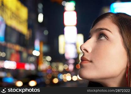 Young Woman on Nighttimes City Street close up profile