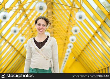 young woman on pedestrain bridge
