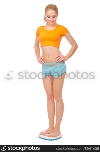 Young woman on scales isolated