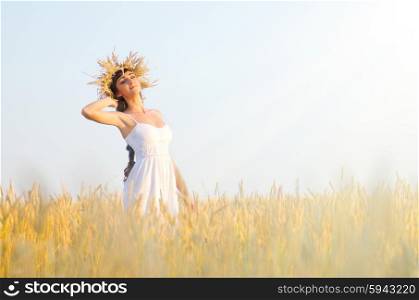 Young woman on the wheat field
