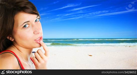 Young woman on tropical beach background.