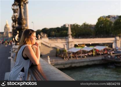 Young woman on vacations in Paris, relaxing over the Alexander the 3rd bridge
