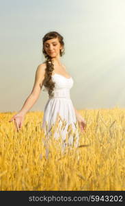 Young woman on wheat field