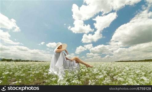 Young Woman On White Field In Summer
