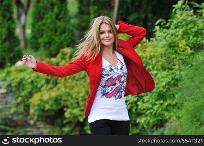 young woman outdoor with fasnionable clothing