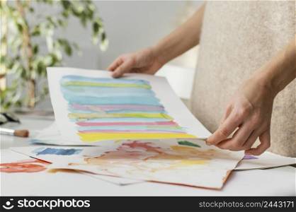 young woman painting with watercolors