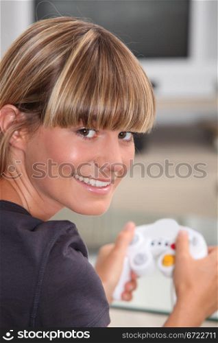 Young woman playing a video game