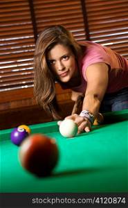 Young Woman Playing Billiards