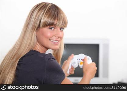 Young woman playing video game