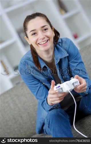 young woman playing video game