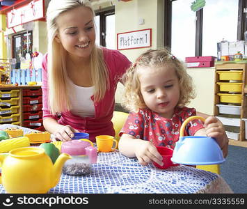 Young woman playing with girl