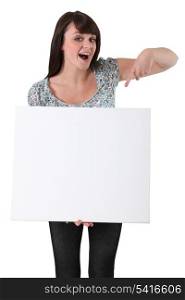 young woman pointing at a blank board