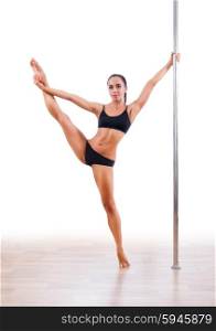 Young woman pole dancer isolated
