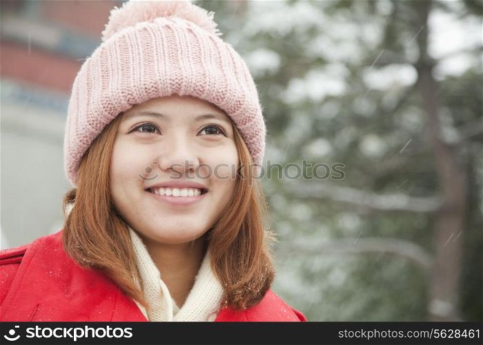 Young woman portrait in snow