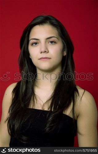 young woman portrait isolated on red background