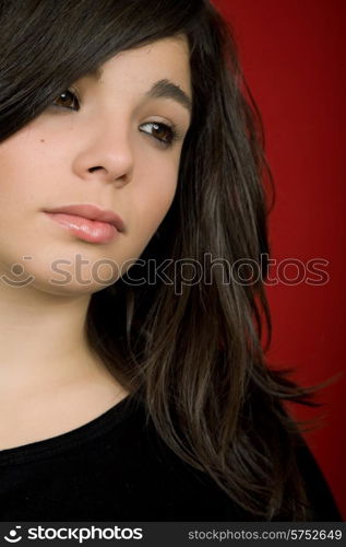 young woman portrait isolated on red background