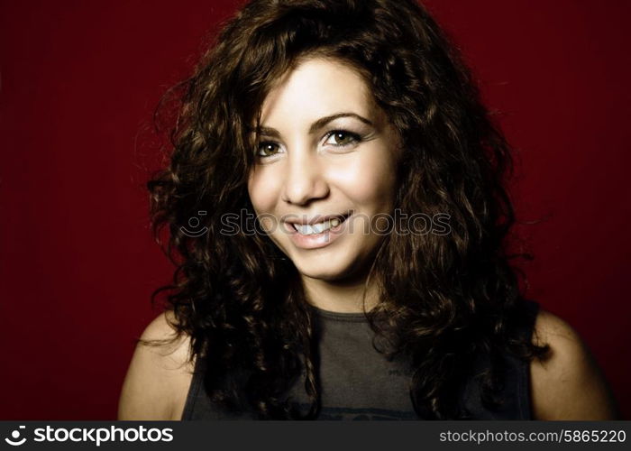 young woman portrait isolated on red background