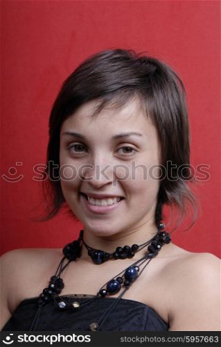 young woman portrait isolated on red background