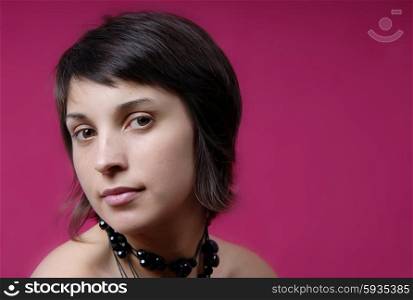 young woman portrait on purple background