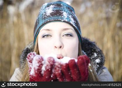 Young Woman Portrait On The Winter Background