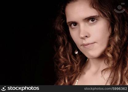 Young woman portrait posing in black background