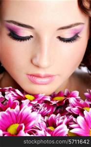 Young woman portrait with chrysanthemum. Spa treatment.