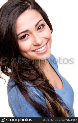 Young woman posing and smiling over white background