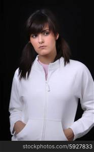 Young woman posing in black background in casual clothes