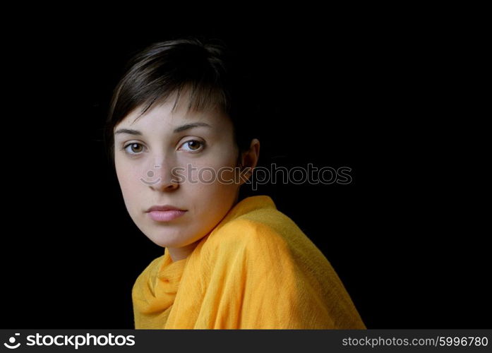 Young woman posing in black background in casual clothes