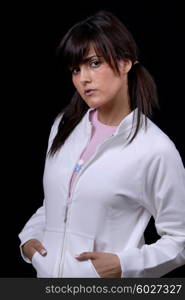 Young woman posing in black background in casual clothes