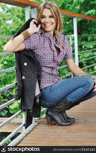 young woman posing in fashion business and caual clothing outdoor